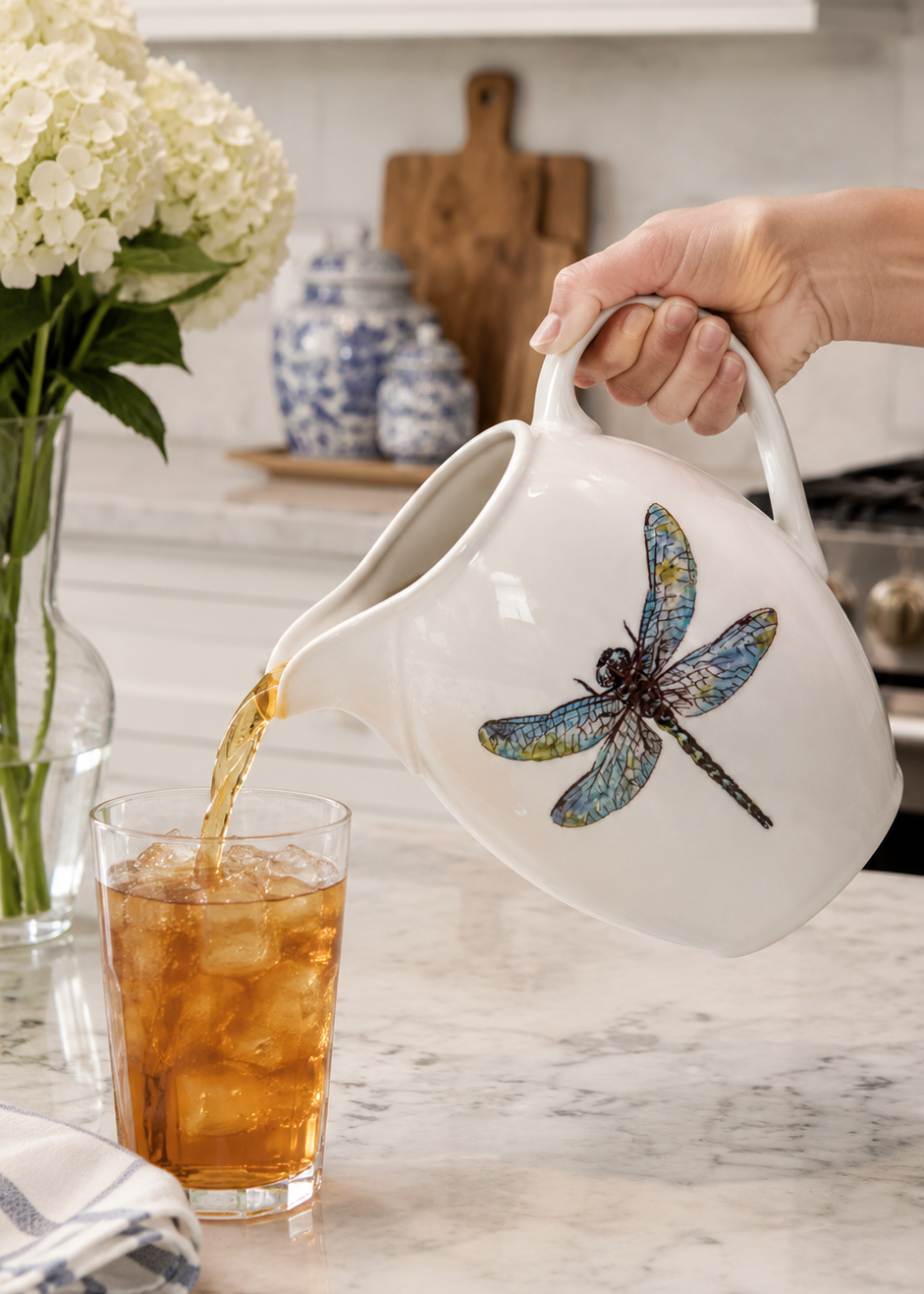 Hand-Painted Dragonfly Porcelain Pitcher – Serving Fresh Iced Tea in a Bright Kitchen