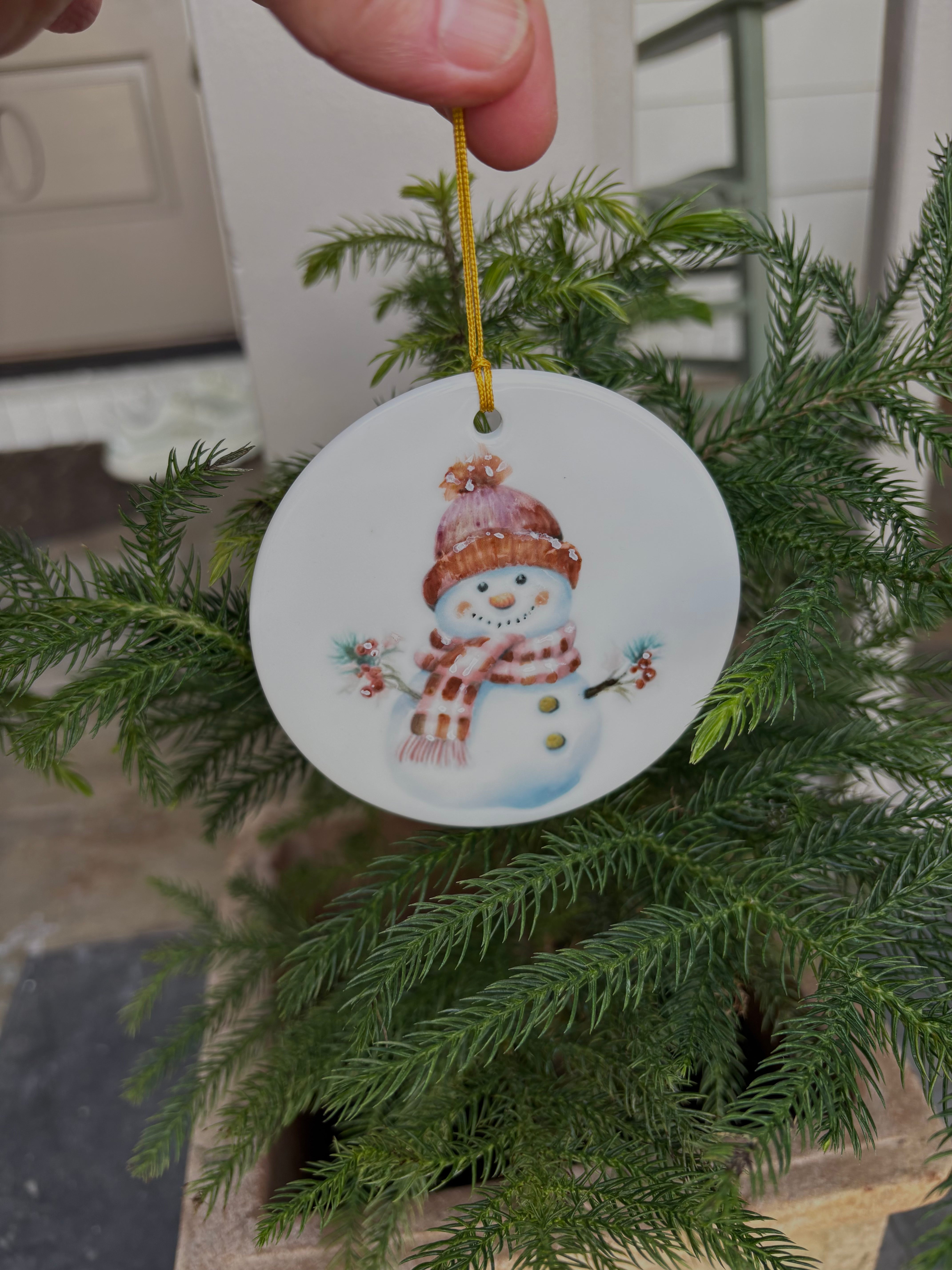Large White Porcelain 3.75" ornament with a hand painted snowman