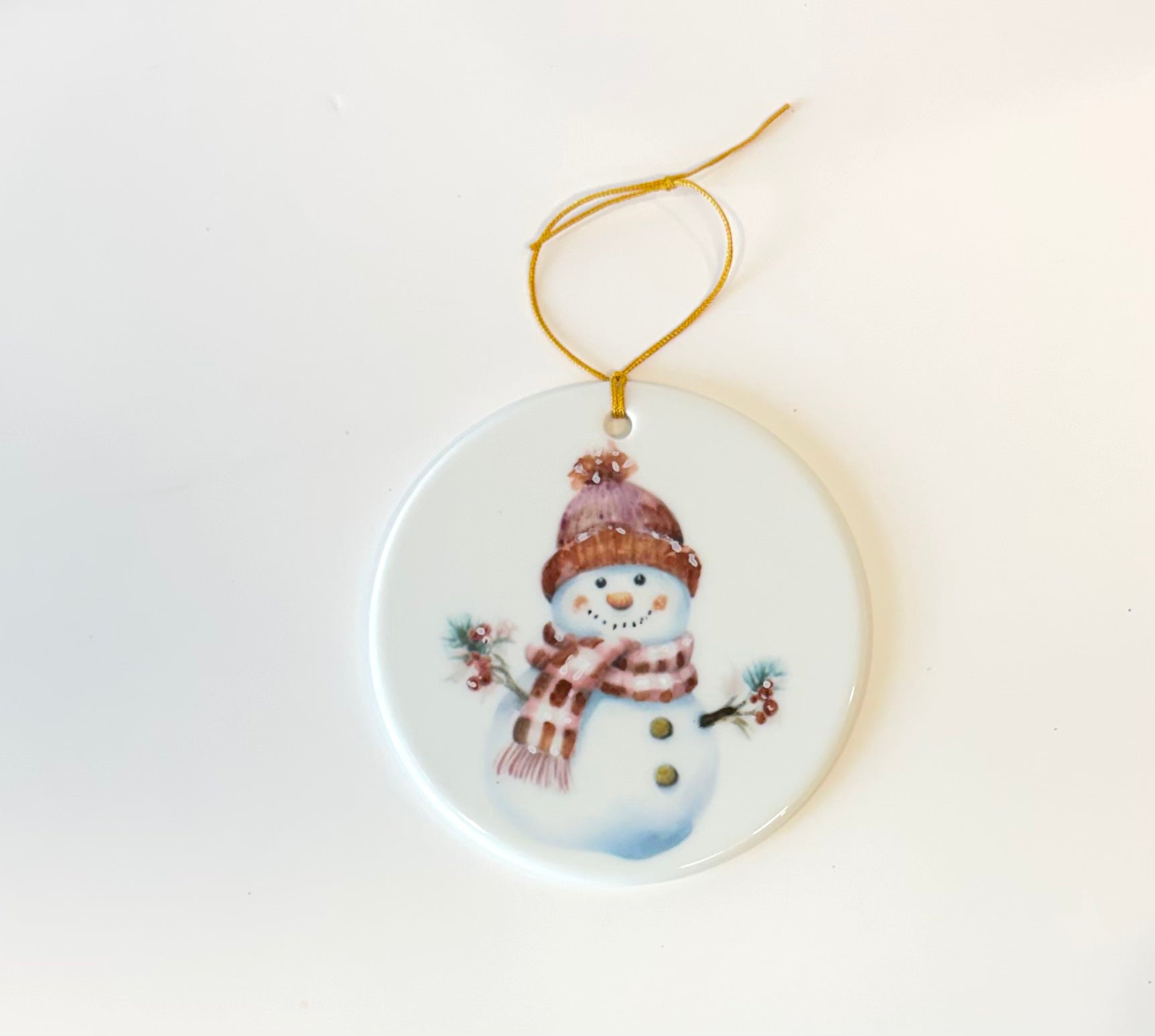 Large White Porcelain 3.75" ornament with a hand painted snowman