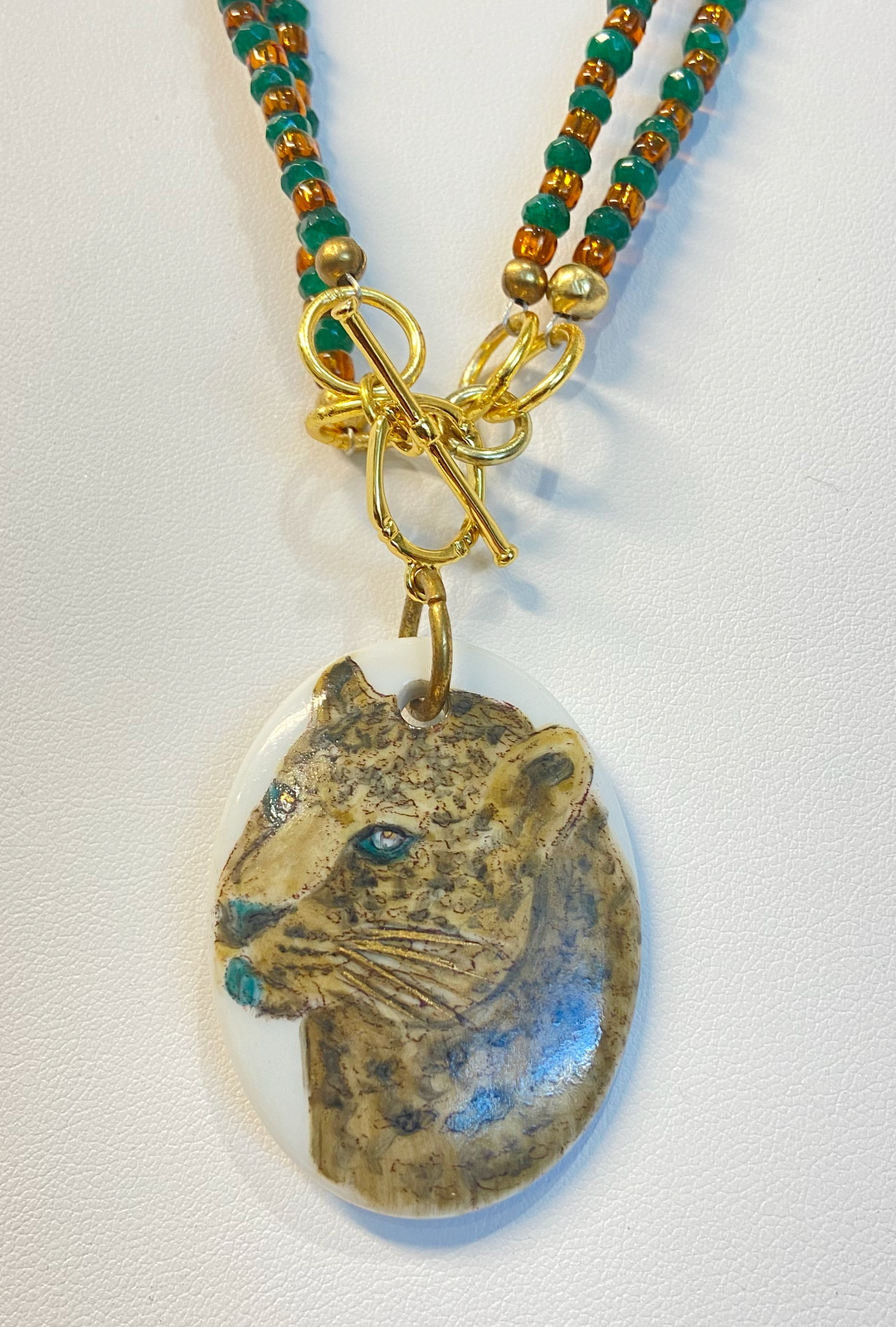 jaguar head pendant, porcelain pendant, toggle clasp, beaded teal and gold necklace