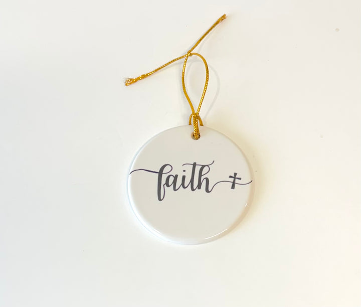 White porcelain round ornament with the wording faith