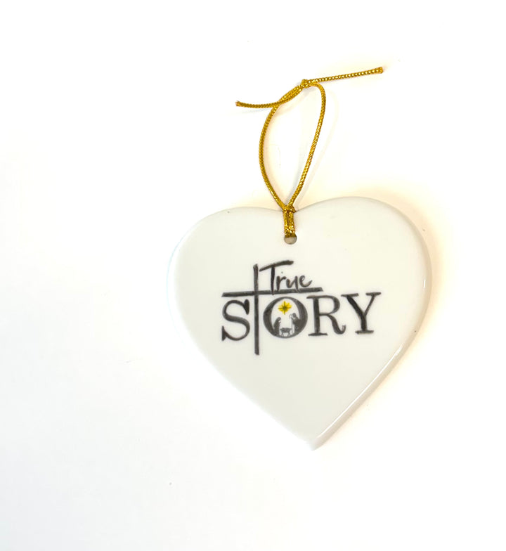 White Heart Porcelain Ornament – “True Story” with Manger Scene, 3.25”