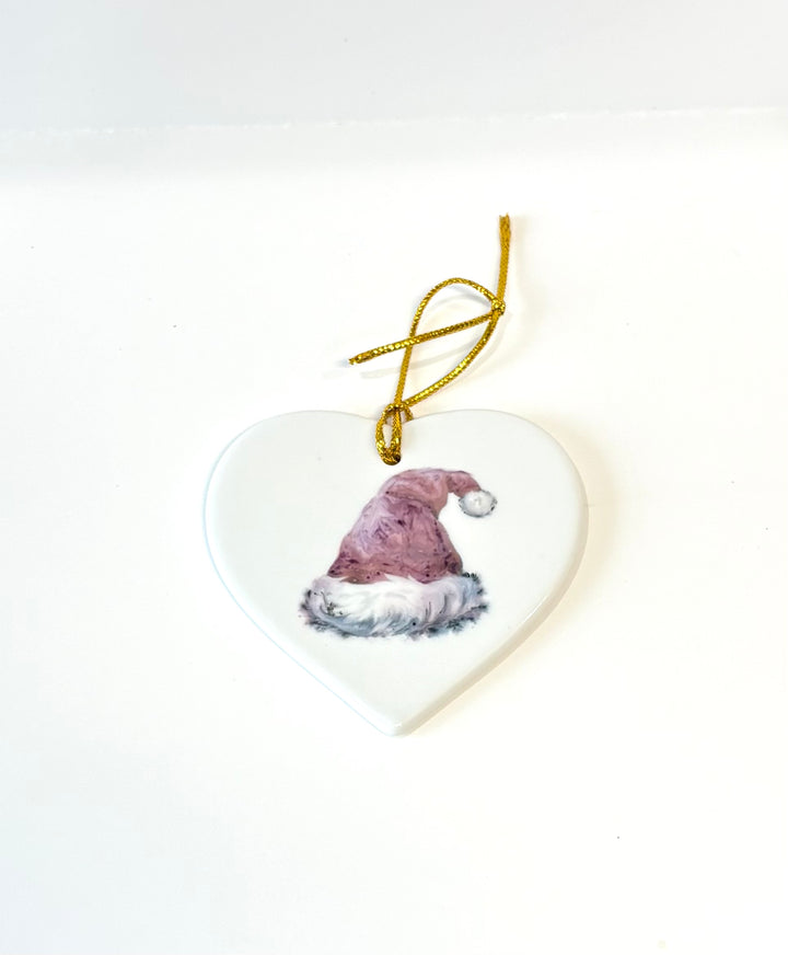 3.5" White Porcelain Heart Ornament with a hand painted Santa Hat