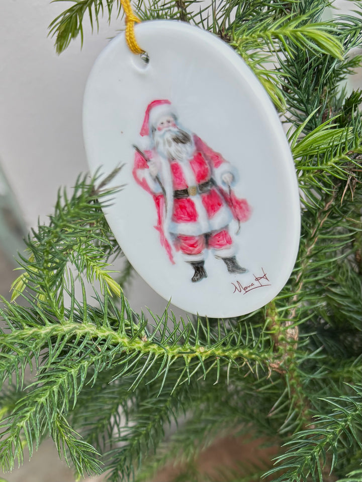 White Oval Porcelain 2.25 x 3.25 Ornament with a Santa Claus