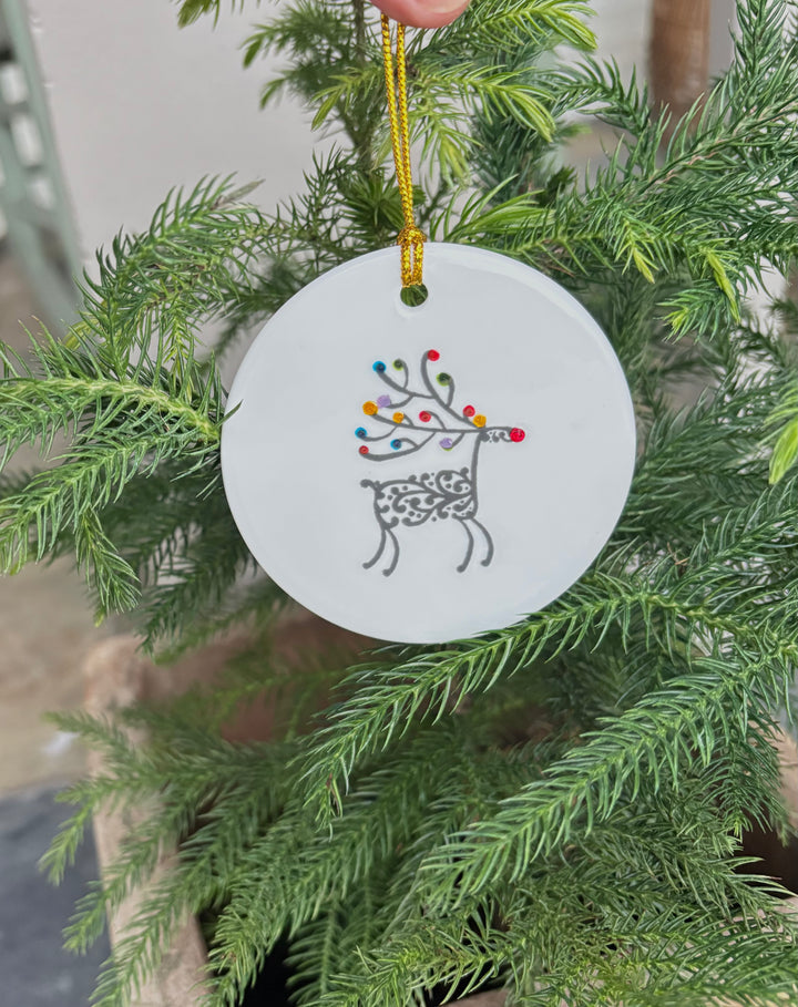 Round 3" White Porcelain Ornament with a Reindeer