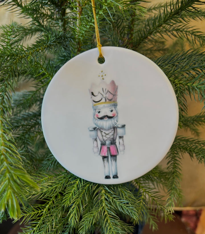 White Porcelain Ornament 3.75" with a hand painted nutcracker